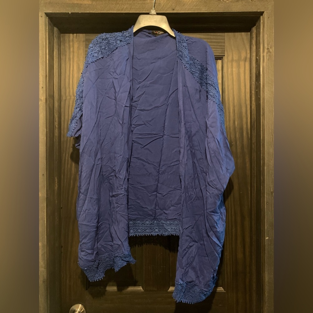 Blue kimono with knit detail.
